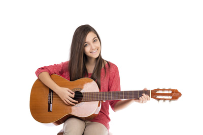 girl posing with classical guitar.
