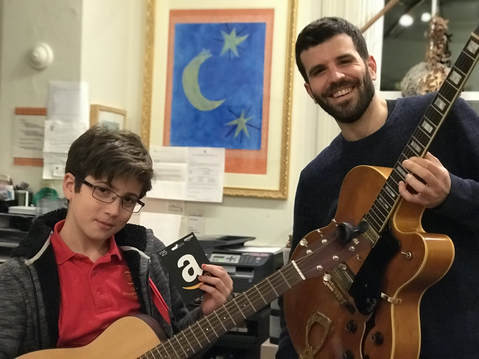 Providence Guitar Academy director with his student Ian after a guitar lesson in Providence, RI. 