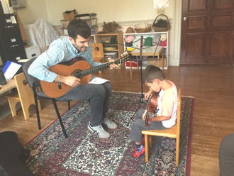 Providence Guitar Academy director, Phil Mazza, teaching his young guitar student named Jake.